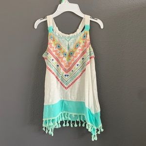 Bohemian style tank top with little tassels on the bottom